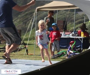 Little A takes on a 'monster wave' made by Dad.