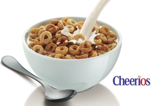 Bowl of Cheerios with milk pouring