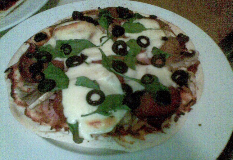 Prosciutto, spinach & olive pizza