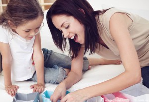 shopping for kids, mum and daughter looking in shopping bags