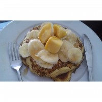Banana, mango and coconut pancake with maple syrup
