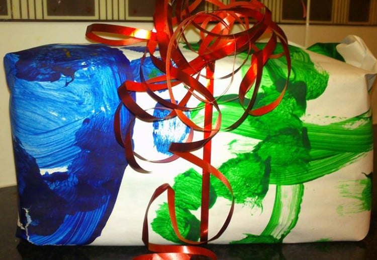 Reuse your kids paintings as wrapping paper
