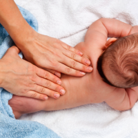 How does massage help colic?