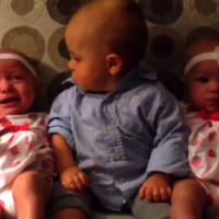 Baby Landon meets twins for the first time