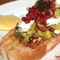 Pomegranate, avocado and goats cheese on sourdough