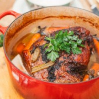 Slow roast lamb in white wine and herbs