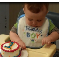 Adorable baby boy eats his first ever birthday cake!
