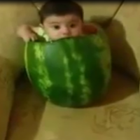 Super cute little baby eating a watermelon.. in a watermelon!