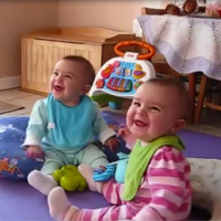 Twins get giddy when dad comes home