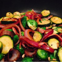 Warm green vege salad with bacon and pinenuts