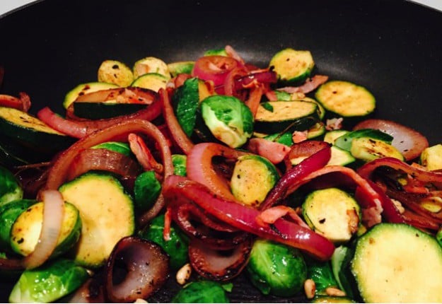 Warm green vege salad with bacon and pinenuts