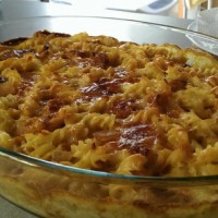 Baked fusilli with cheesy onion and carrot sauce