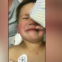 Little boy left terrified after close call with a falling glass door