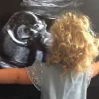 The moment a 2 year old first sees the scan of her baby sister