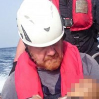 Heartbreaking photo of drowned baby being cradled by a charity worker