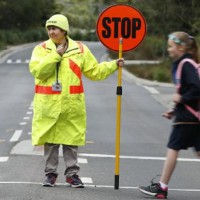 Lollipop lady banned from offering kids treats