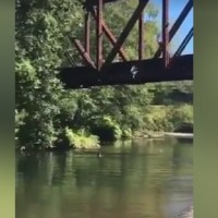 Shocking video shows mum cheering as son is thrown from a bridge