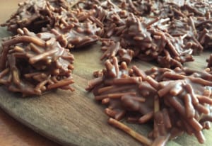 Best Chocolate Spiders Recipe. Melted chocolate and crunchy noodles melted together to form little chocolate spiders.