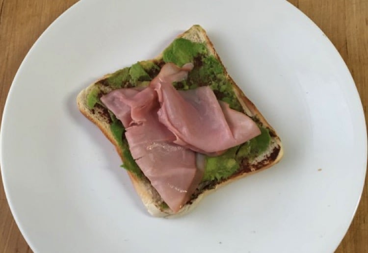 Smashed avo on toast with vegemite and ham