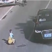 FOOTAGE captures a toddler driving toy car through traffic