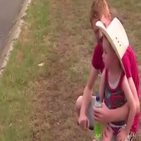 Little boy looking after the fireman in NSW