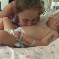 Baby wakes from coma after big sister blew a raspberry on her