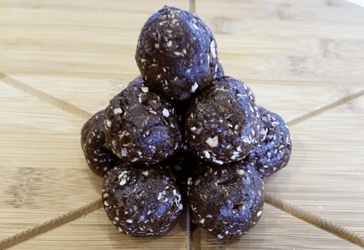 A stack of round chocolate and mint bliss balls.