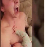 Hungry baby snuggled on daddy's bare chest. The results are classic!