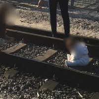 OMG Baby Posed For Photo in Middle of a Train Track