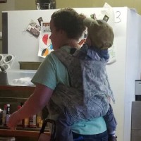 Photo of a Working Mum With Toddler on Her Back Goes Viral