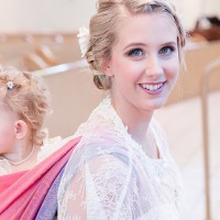 Bride Walks Down the Aisle Baby Wearing her Toddler on her Back