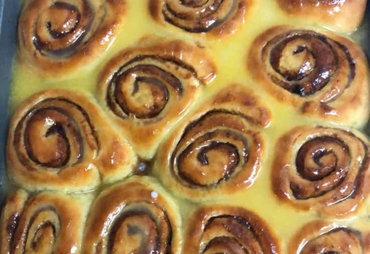 Delicious cinnamon rolls cooking together. 6 sweet scrolls together