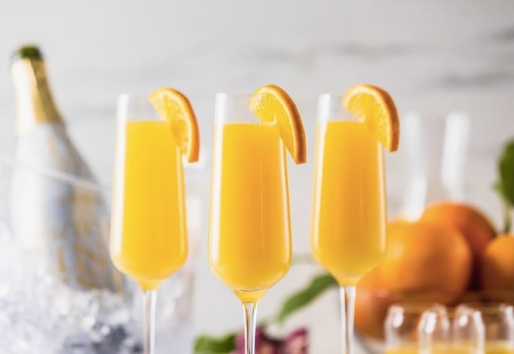 Refreshing fruity mimosa cocktail