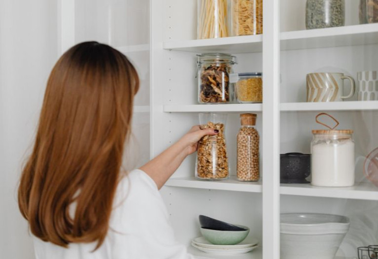 lady organising shelf