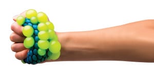 A hand holding atomic brain stress ball