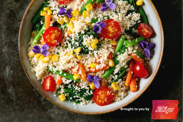 brightly coloured cous cous salad made with boiling water from a zip tap