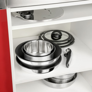 Cookware sitting neatly in a cupboard