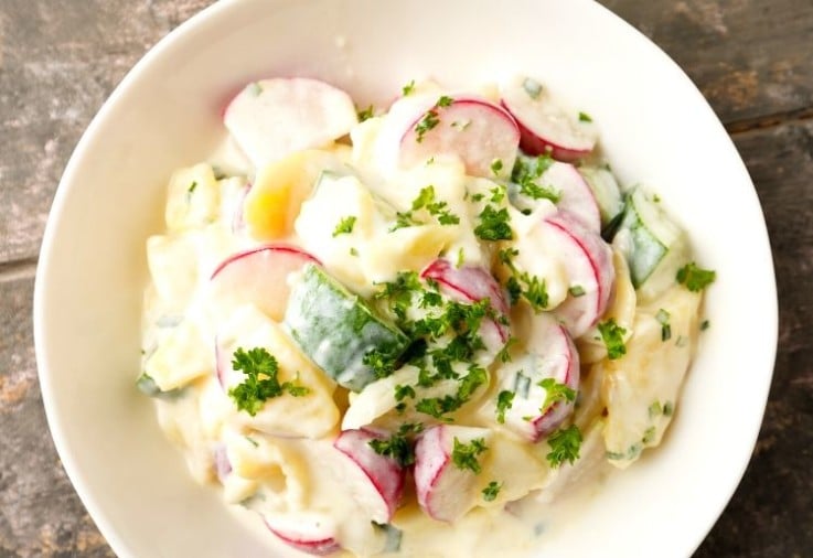 Potato Salad Recipe with added radish and cucumber for that extra crunch garnished with continental parsley