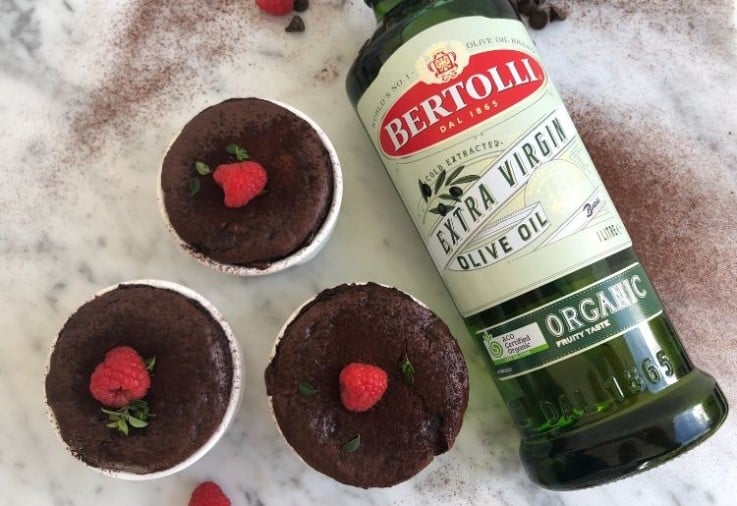 Chocolate Puddings with Raspberries served in individual white ramekins developed for Bertolli Extra Virgin Olive OIl Organic Fruity Taste