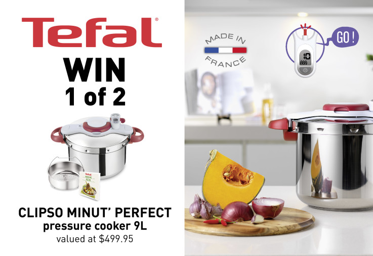 A Tefal Pressure Cooker sitting on a white kitchen bench surrounded by fresh food