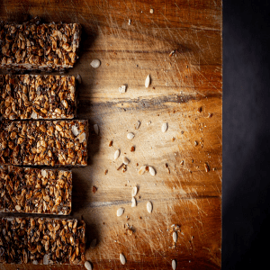 Nutritious seed bars on a wooden chopping board