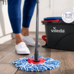 Lady mopping with the Vileda Rinse Clean Spin Mop & Bucket Set