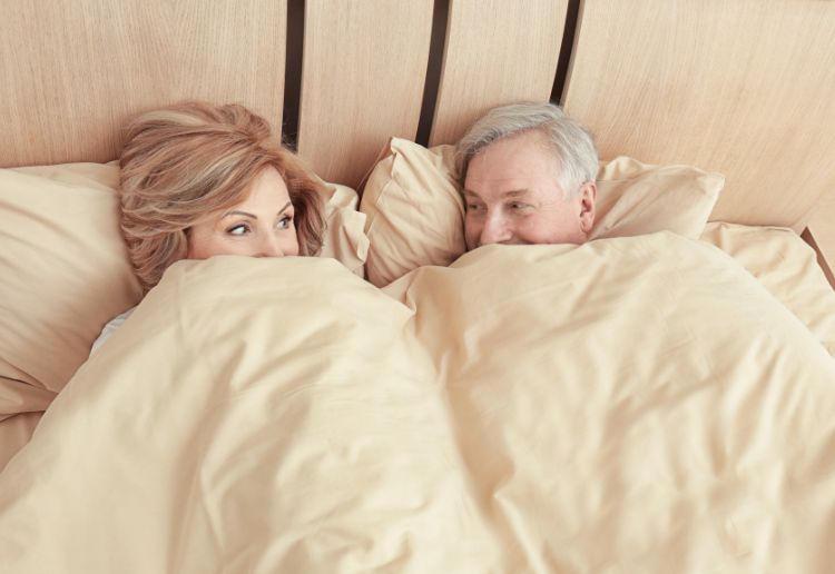 Elderly couple in bed