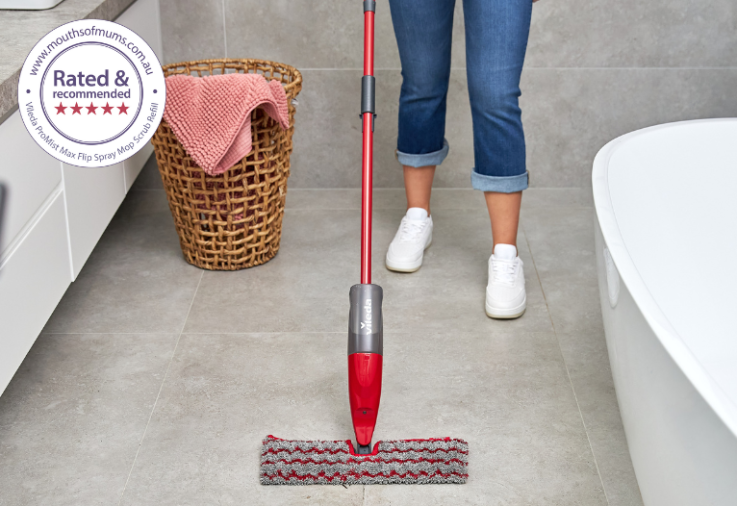 woman mopping with the Vileda ProMist Max Flip Spray Mop Scrub Refill