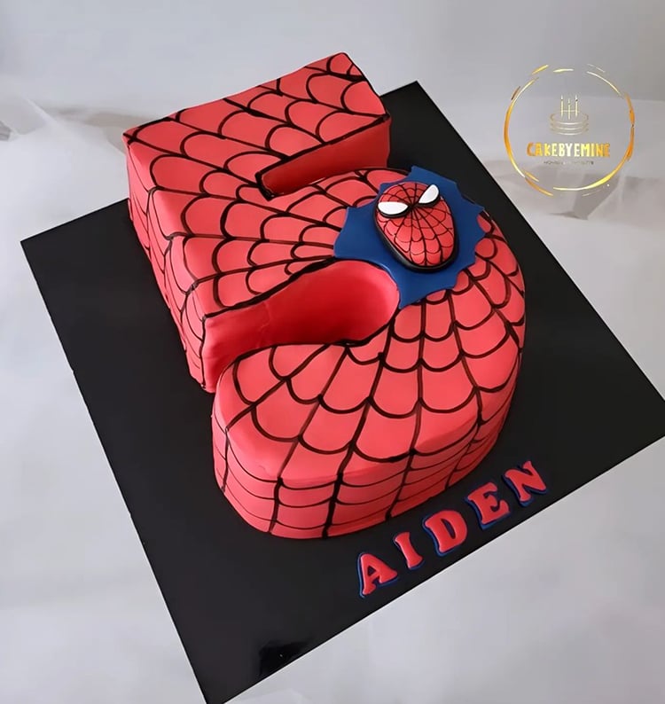 Spiderman-themed cake in the shape of a number 5.