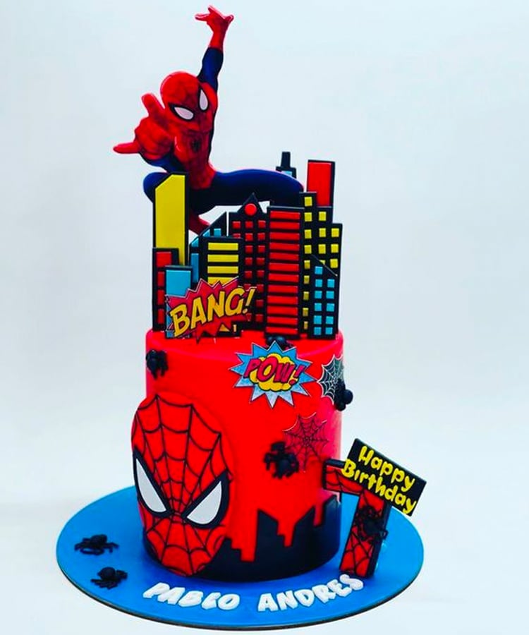 Kids Spiderman cake with edible buildings on top.