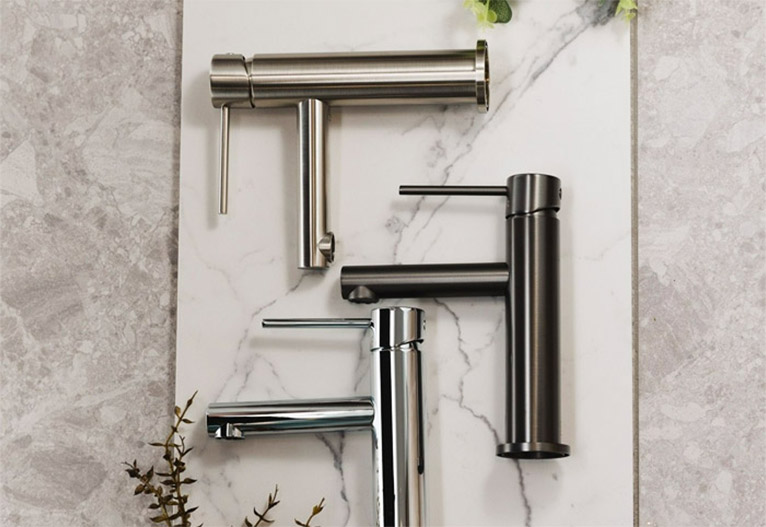 Selection of three basin mixer taps in different colours and finishes. 