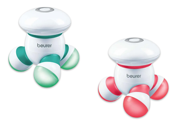 Image of a green and pink mini massager on a white background.
