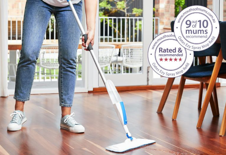 Woman mopping with the oates ezy spray mop