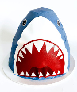 Kids' cake shaped like a shark's head.